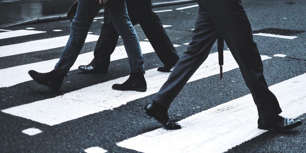 people walking on a crossing