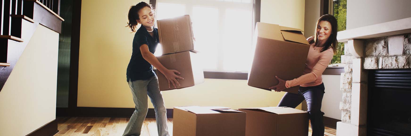 a mother and daughter with moving boxes